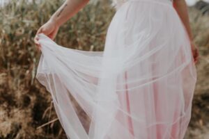 A photo of a woman wearing a pink tulle princesscore dress